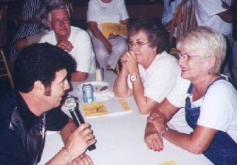 Elvis sings and the ladies love it while Jack Wilcher looks on.